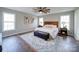 Main bedroom with wood flooring and ceiling fan at 131 Nantz Ave, Mount Holly, NC 28120