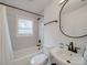 Modern bathroom with white vanity, bathtub and fixtures at 1330 Mulberry Ave, Charlotte, NC 28216