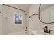 Clean bathroom with a bathtub, shower, and updated vanity at 1330 Mulberry Ave, Charlotte, NC 28216