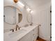 Modern bathroom with double vanity, quartz countertop, and gold accents at 1330 Mulberry Ave, Charlotte, NC 28216