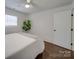 Bright bedroom featuring wood floors and a ceiling fan at 1330 Mulberry Ave, Charlotte, NC 28216