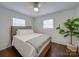 Spacious bedroom with wood floors and a ceiling fan at 1330 Mulberry Ave, Charlotte, NC 28216