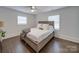 Well lit bedroom with wood floors and ceiling fan at 1330 Mulberry Ave, Charlotte, NC 28216