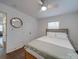 Charming bedroom with wood floors, ceiling fan and mirror at 1330 Mulberry Ave, Charlotte, NC 28216