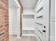 Inviting entryway with built-in shelving and modern door at 1330 Mulberry Ave, Charlotte, NC 28216