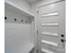 Bright entryway with built-in bench and coat hooks at 1330 Mulberry Ave, Charlotte, NC 28216