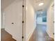 Bright hallway with hardwood floors and modern doors at 1330 Mulberry Ave, Charlotte, NC 28216