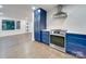 Modern kitchen with blue cabinets and stainless steel appliances at 1330 Mulberry Ave, Charlotte, NC 28216