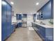 Modern kitchen with stainless steel appliances and blue cabinetry at 1330 Mulberry Ave, Charlotte, NC 28216