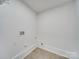 Simple laundry room with hookups and ample space at 1330 Mulberry Ave, Charlotte, NC 28216