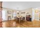 Charming dining area with wood floors and a wooden table at 135 Rumple Hill Dr, Statesville, NC 28677