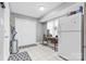 Laundry room with white cabinets and a refrigerator at 135 Rumple Hill Dr, Statesville, NC 28677