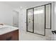 Bathroom with walk-in shower, marble tile, and modern fixtures at 13732 Roderick Dr # 170, Huntersville, NC 28078