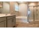 Bathroom boasts a soaking tub, shower, and double vanity at 138 Gray Willow St, Mooresville, NC 28117