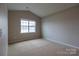 Bright bedroom featuring vaulted ceilings and carpet at 138 Gray Willow St, Mooresville, NC 28117