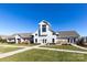 Beautiful community clubhouse featuring manicured lawns, stone accents, and a welcoming entryway at 138 Gray Willow St, Mooresville, NC 28117