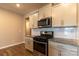 Modern kitchen with stainless steel appliances and granite countertops at 138 Gray Willow St, Mooresville, NC 28117