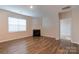 Living room with corner fireplace and hardwood floors at 138 Gray Willow St, Mooresville, NC 28117