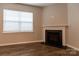 Living room features corner fireplace and hardwood floors at 138 Gray Willow St, Mooresville, NC 28117