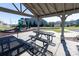 Shaded picnic area with tables, a grill, and a playground for outdoor gatherings in the community at 138 Gray Willow St, Mooresville, NC 28117