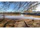 Scenic view of the pond with a trail leading to the water's edge at 138 Gray Willow St, Mooresville, NC 28117