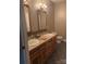 Bathroom with double vanity and wood cabinets at 158 White Rd, Wadesboro, NC 28170