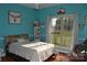 Bright bedroom with a queen bed and large window at 158 White Rd, Wadesboro, NC 28170