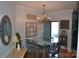 Formal dining room with chandelier, hardwood floors, and decorative accents at 158 White Rd, Wadesboro, NC 28170