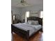 Spacious main bedroom with large bed and hardwood floors at 158 White Rd, Wadesboro, NC 28170