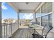 Front porch with wooden deck, metal chairs, and a small table at 160 Millen Dr, Mooresville, NC 28115