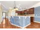 Kitchen with breakfast bar and light blue walls at 160 Millen Dr, Mooresville, NC 28115