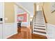 Elegant staircase with white risers and wooden handrail at 160 Millen Dr, Mooresville, NC 28115