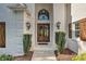 Inviting entryway with double doors and elegant light fixtures at 19100 Mary Ardrey Cir, Cornelius, NC 28031