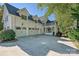 Three-car garage and inviting front porch of this stunning home at 19100 Mary Ardrey Cir, Cornelius, NC 28031