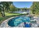 Stunning pool with patio furniture and lake views at 19100 Mary Ardrey Cir, Cornelius, NC 28031