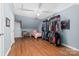 Bedroom with light pink bed, wood floors and a large closet at 303 Knox St, Clover, SC 29710