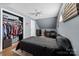 Bedroom with a black bed, dresser and walk-in closet at 303 Knox St, Clover, SC 29710