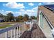 Wooden deck overlooking the street, with a view of houses and trees at 303 Knox St, Clover, SC 29710