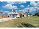 Two-story home with a detached garage and solar panels at 303 Knox St, Clover, SC 29710