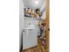 White Maytag washer and dryer in a well-lit laundry room with ample storage shelves at 303 Knox St, Clover, SC 29710