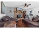 Living room features a brick fireplace, hardwood floors, and comfy seating at 303 Knox St, Clover, SC 29710