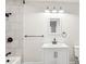 Modern bathroom with white vanity, tiled shower, and bathtub at 309 S Ransom St, Gastonia, NC 28052