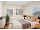 Bedroom with light walls, hardwood floors, and a wooden bed frame at 309 S Ransom St, Gastonia, NC 28052