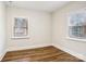 Simple bedroom with hardwood floors and neutral walls at 309 S Ransom St, Gastonia, NC 28052