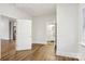 Spacious bedroom with hardwood floors and access to the kitchen and bathroom at 309 S Ransom St, Gastonia, NC 28052