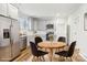 Virtually staged kitchen with gray cabinets and stainless steel appliances at 309 S Ransom St, Gastonia, NC 28052