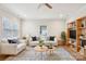 Cozy living room features a striped rug, comfortable seating, and a bookshelf with TV at 309 S Ransom St, Gastonia, NC 28052