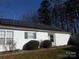 Home exterior with solar panels and landscaping at 8027 Bristle Ln, Charlotte, NC 28214