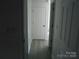 Clean hallway with doors to rooms at 8027 Bristle Ln, Charlotte, NC 28214