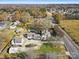 House, pool, and detached garage are shown in this wide aerial view at 8478 Rocky River Rd, Harrisburg, NC 28075